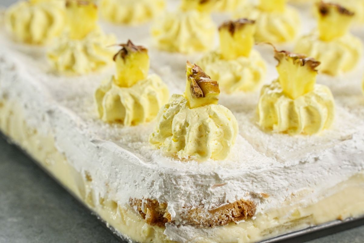 up close image of Italian cream cake topped with pineapples