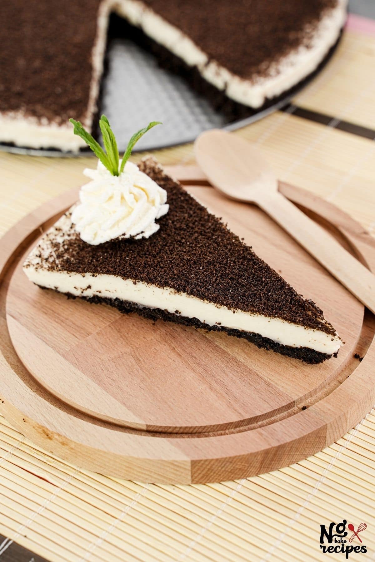wood plate of no bake cheesecake on table