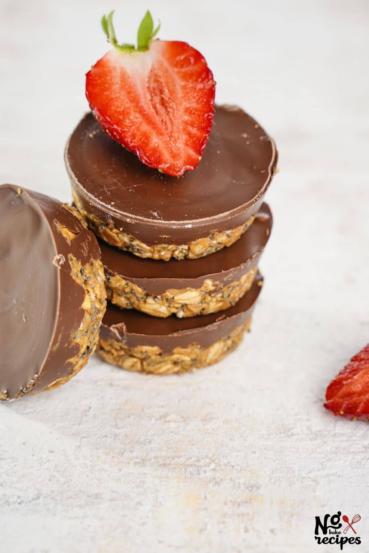 stack of three chocolate oatmeal cups with strawberry slice on top