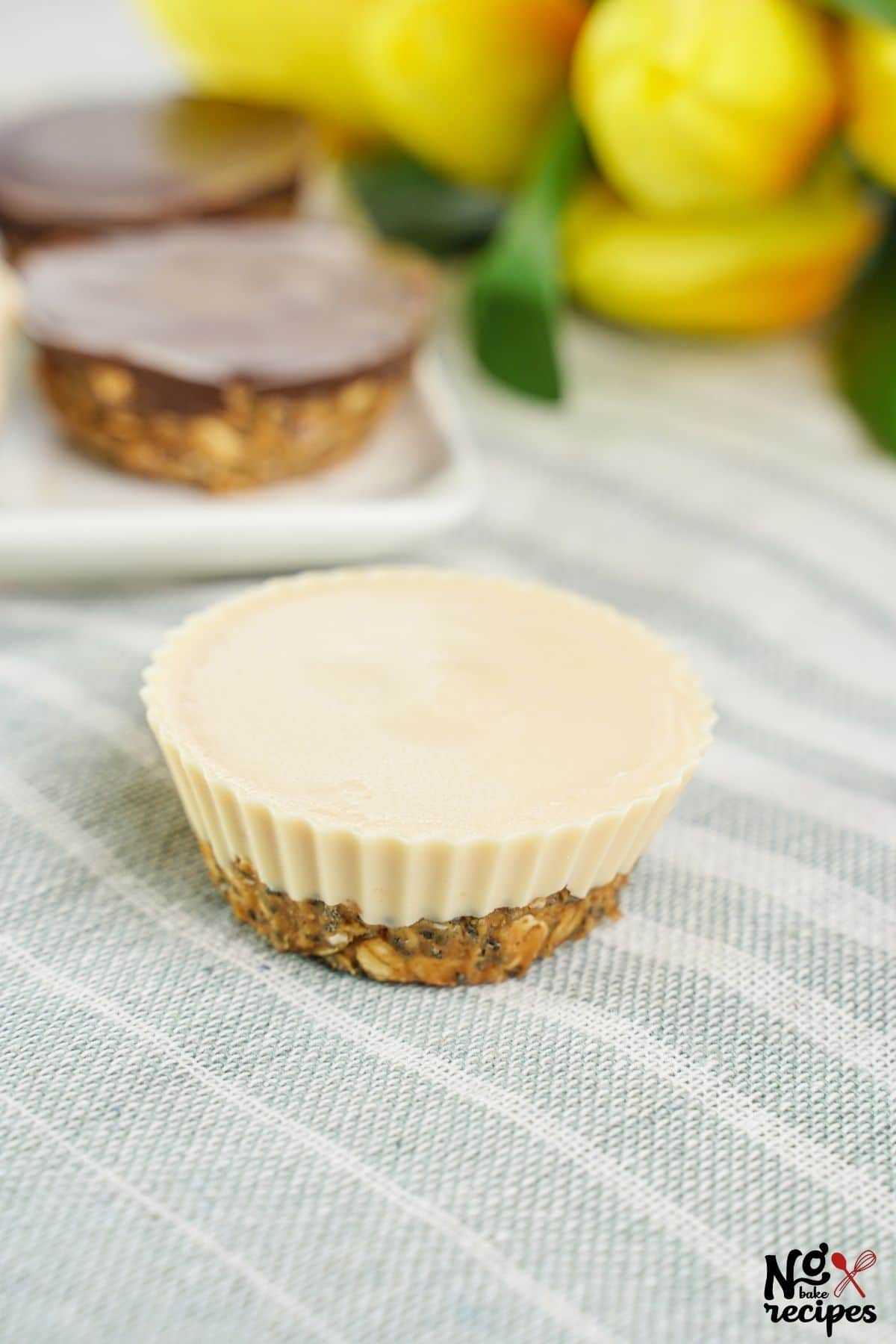 white chocolate and milk chocolate oatmeal cups on striped napkin