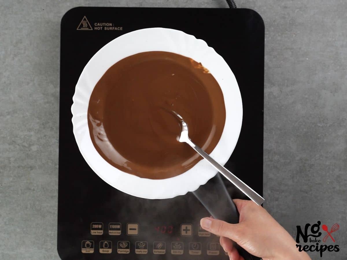 melted chocolate in white pan on hot plate