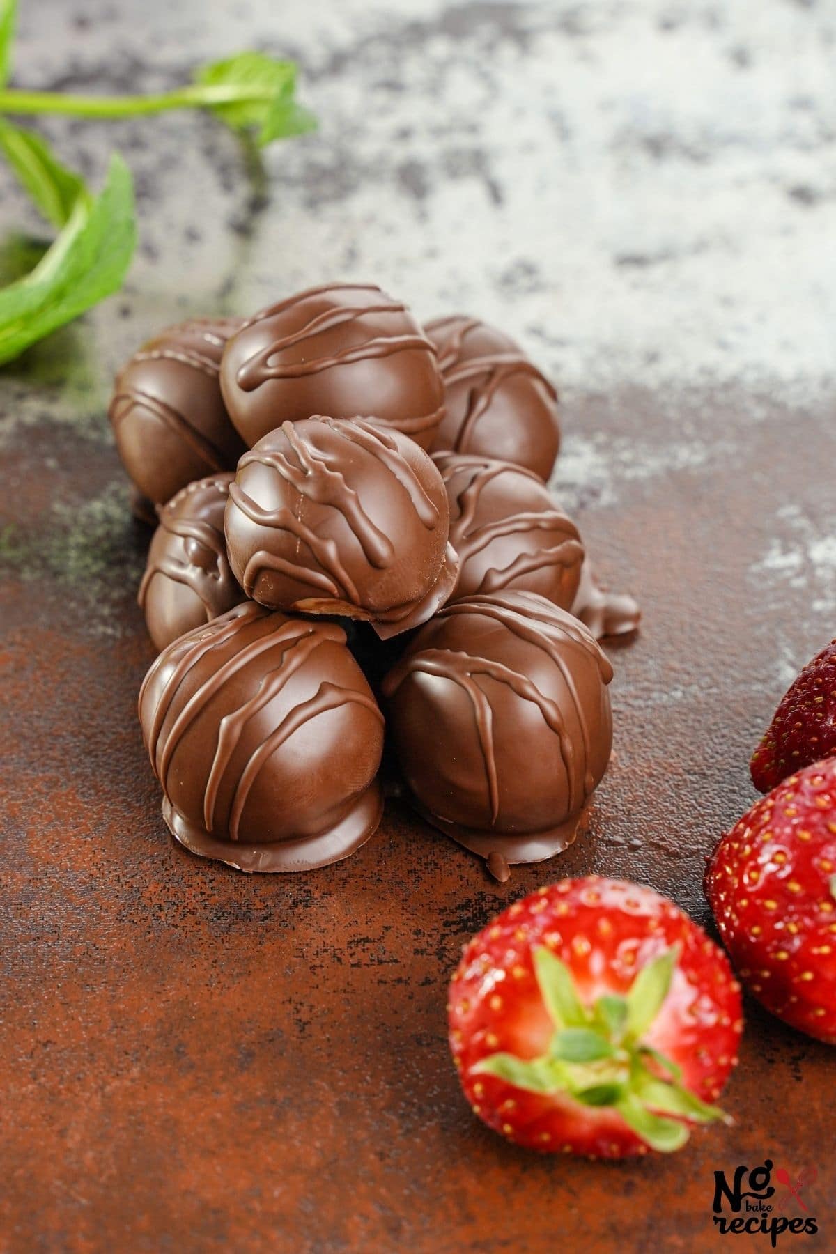 truffles stacked on table by strawberries