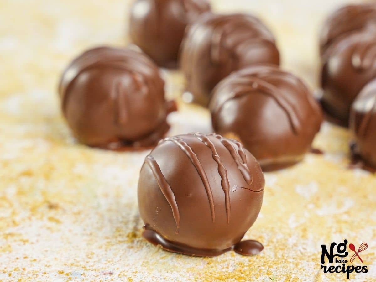 peanut butter cup truffles on yellow table