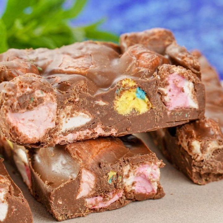 stacks of rocky road bars on wood with blue background