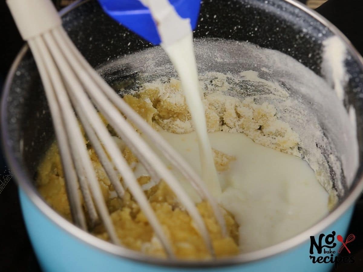 whisk in saucepan of flour and milk