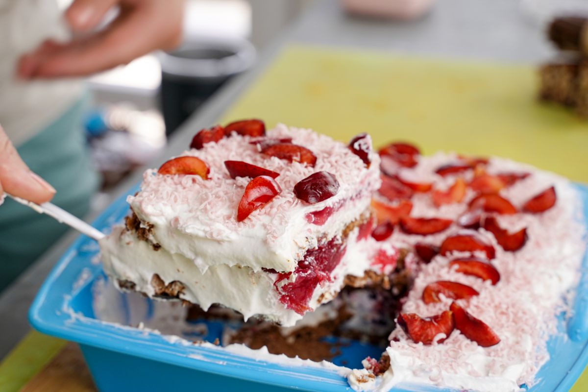 icebox cake being lifted out of baking pan