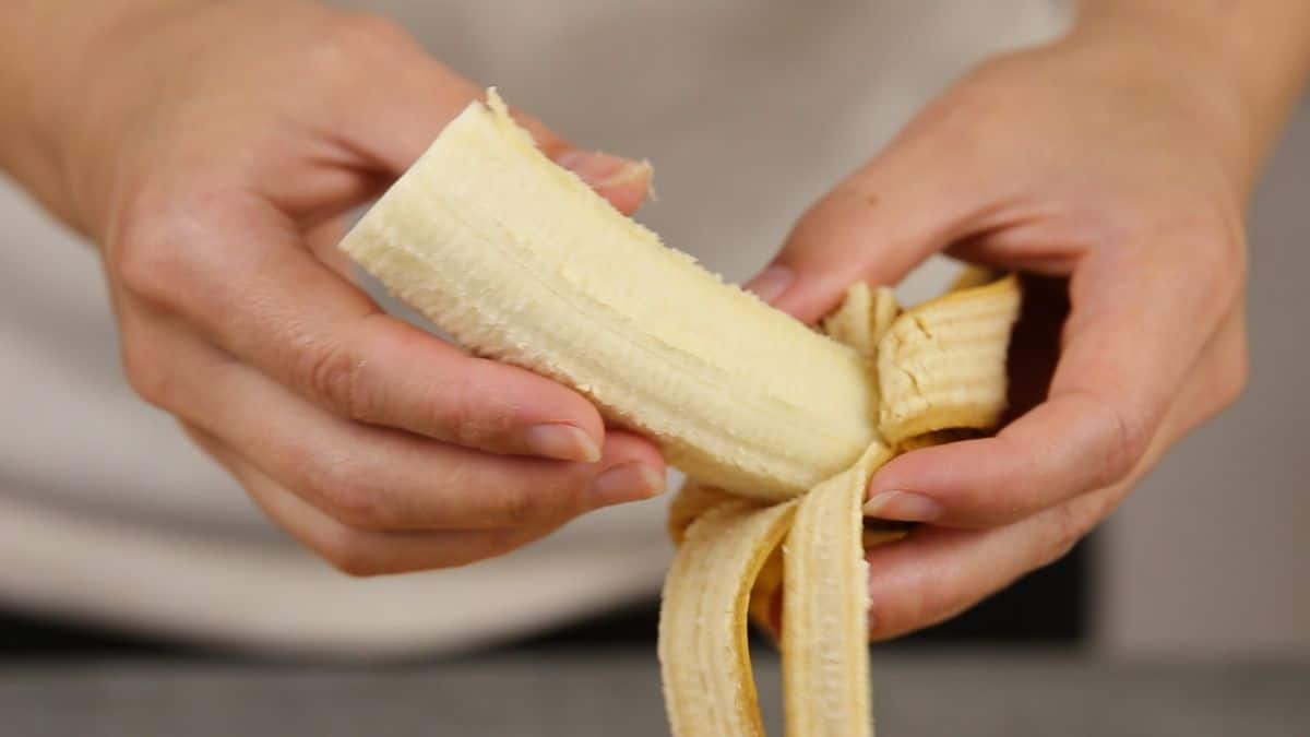 Cut the bananas into half and peel off