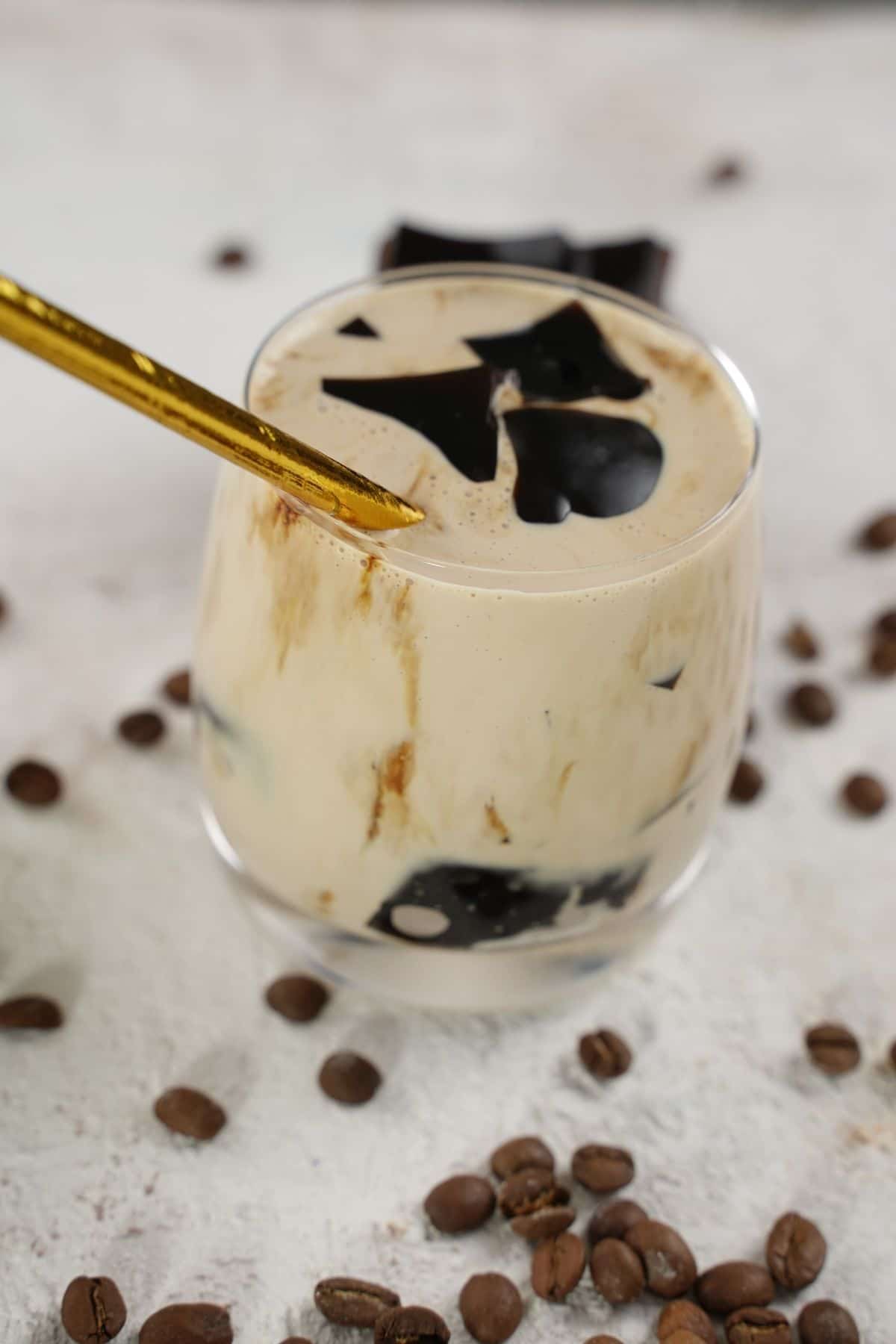 Coffee Jelly Drink served with golden spoon
