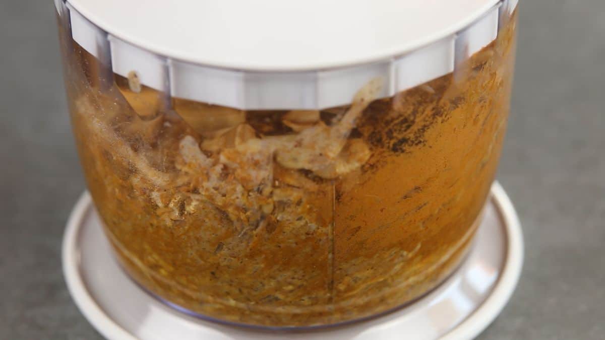 food processor filled with ingredients for energy balls