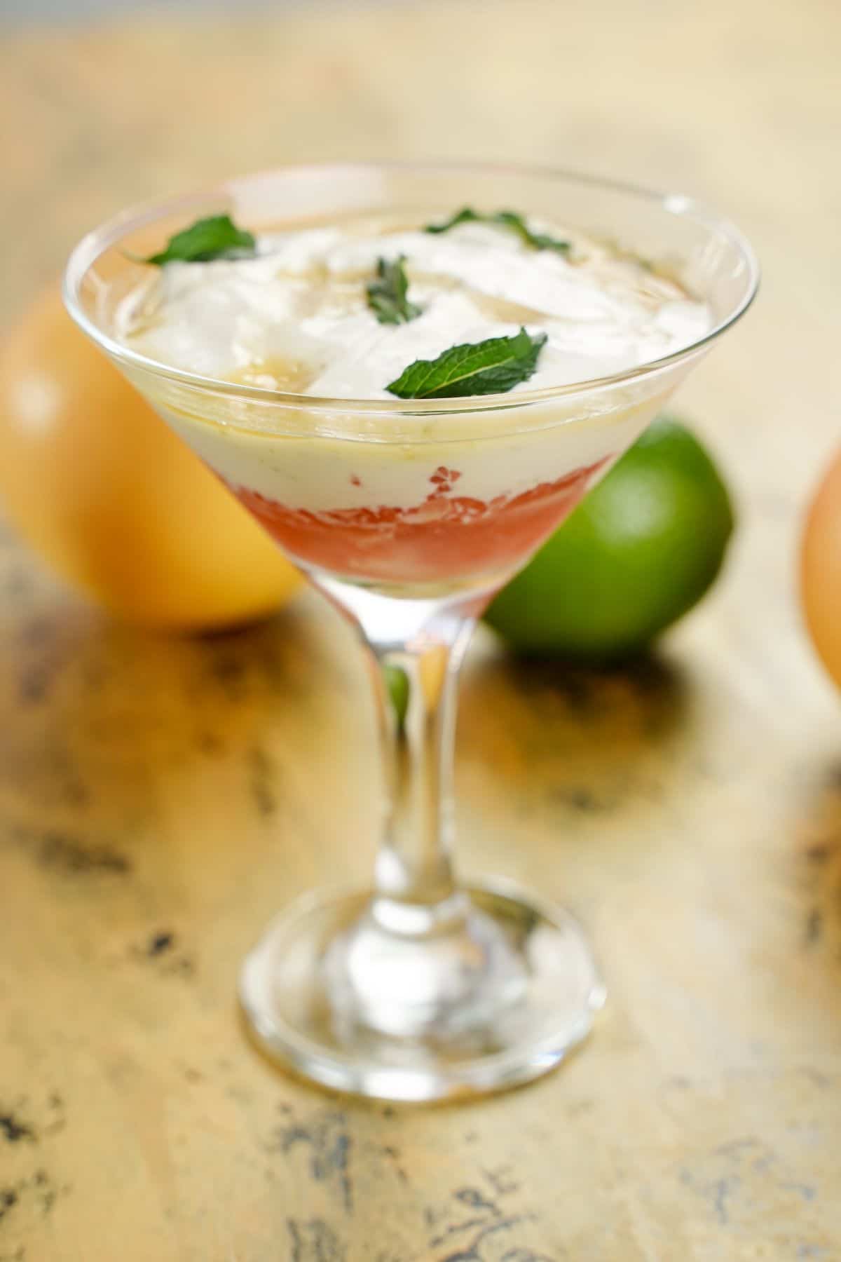 close-up image of grapefruit lime mint yogurt parfait in a martini glass