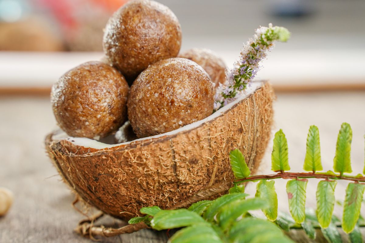 No-Bake Lemon Protein Balls served in coconut with mint leaves