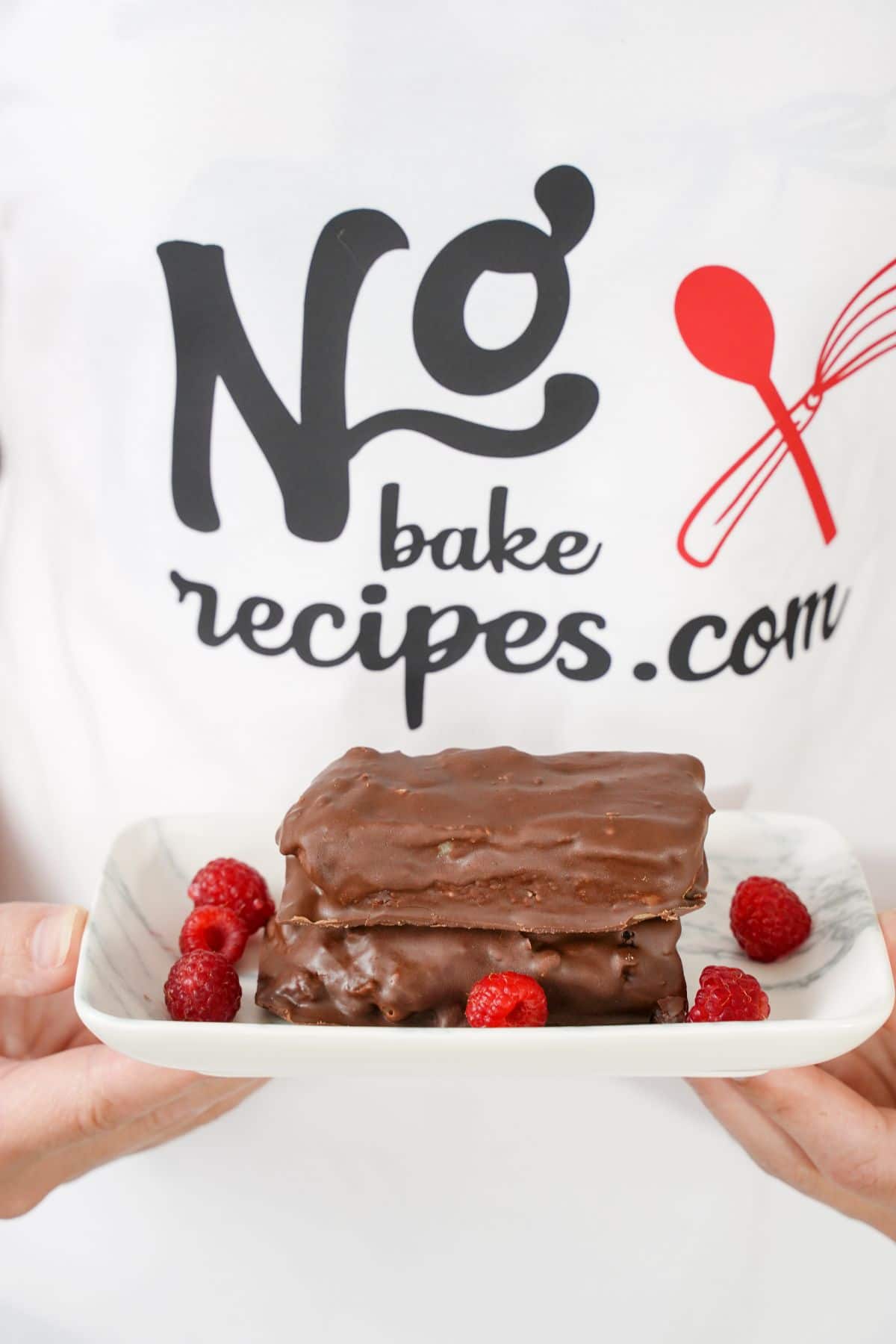 No-Bake Snickers Bars served with fresh raspberry