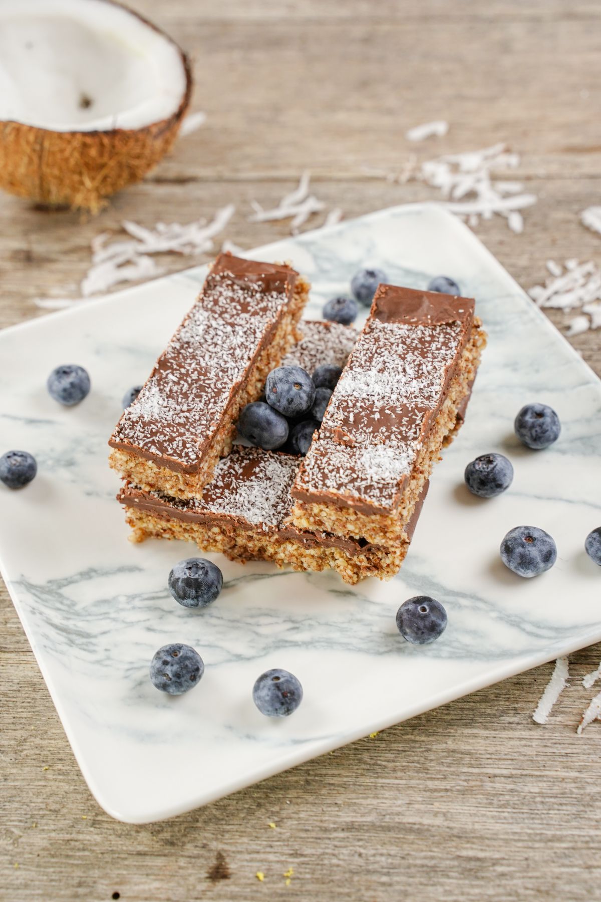 No-Bake Toasted Coconut and Almond Granola Bars served with blueberries
