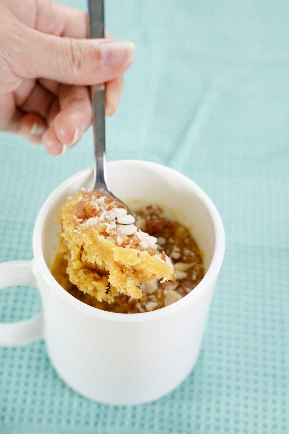 A spoon full of Peanut Butter Cookie in a Mug