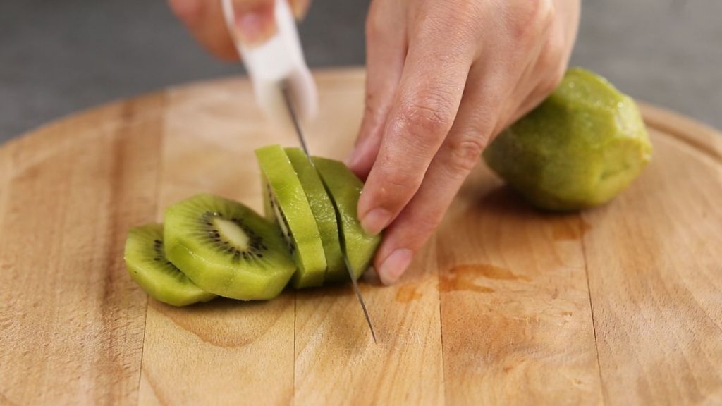 Cut kiwi into slices