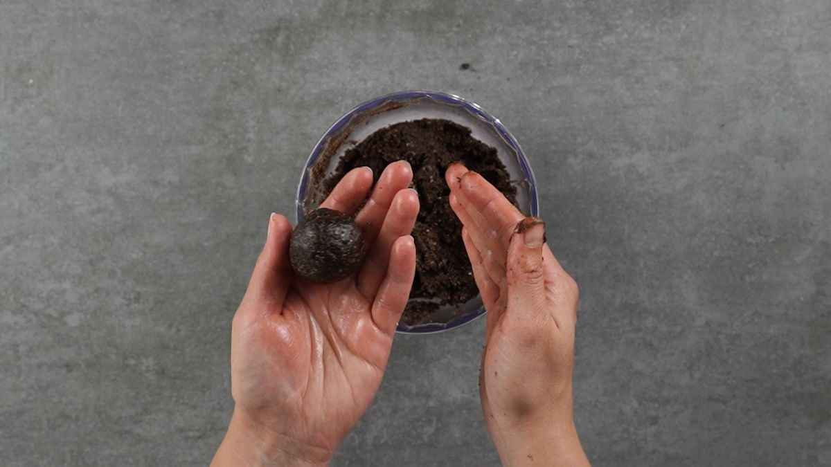 hand forming ball from chocolate crumbs