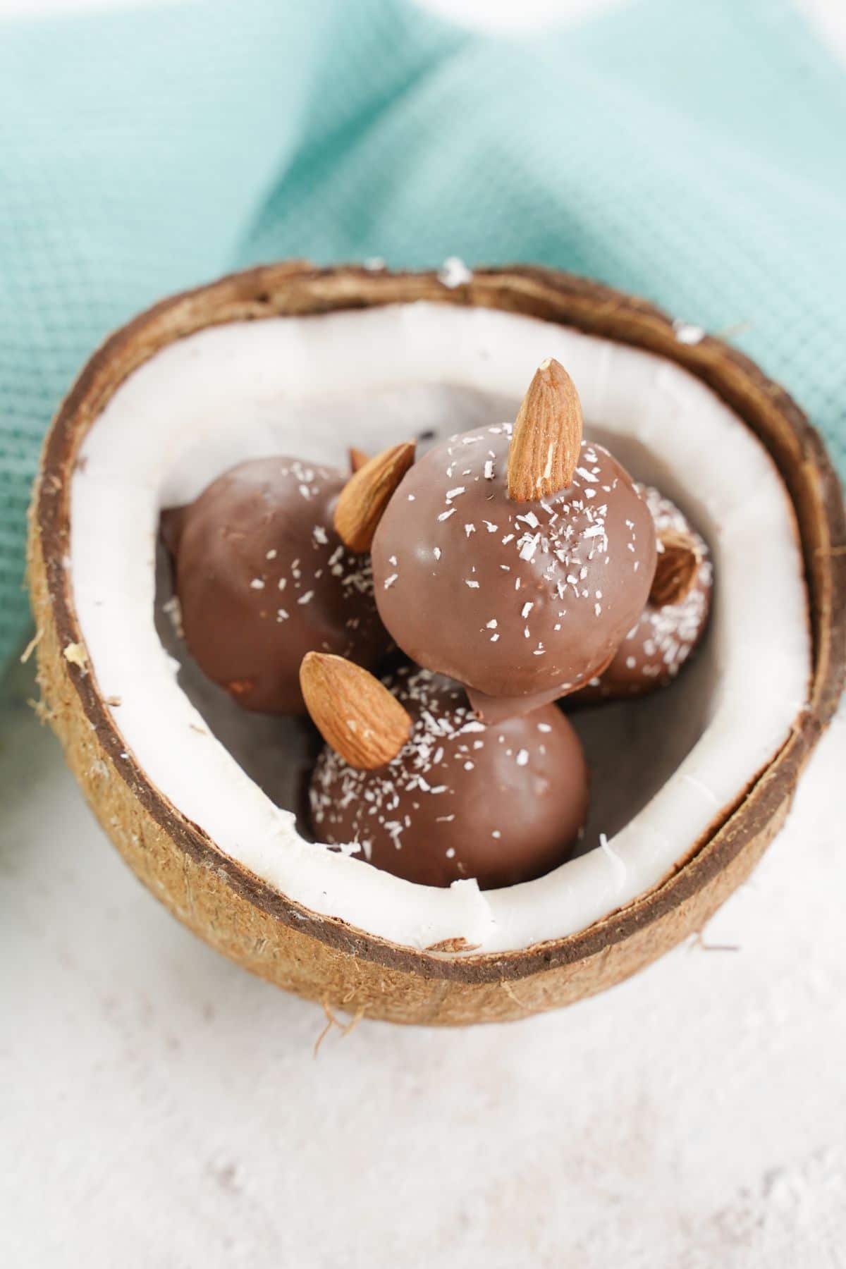 Chocolate Coconut Almond Balls served in half coconut