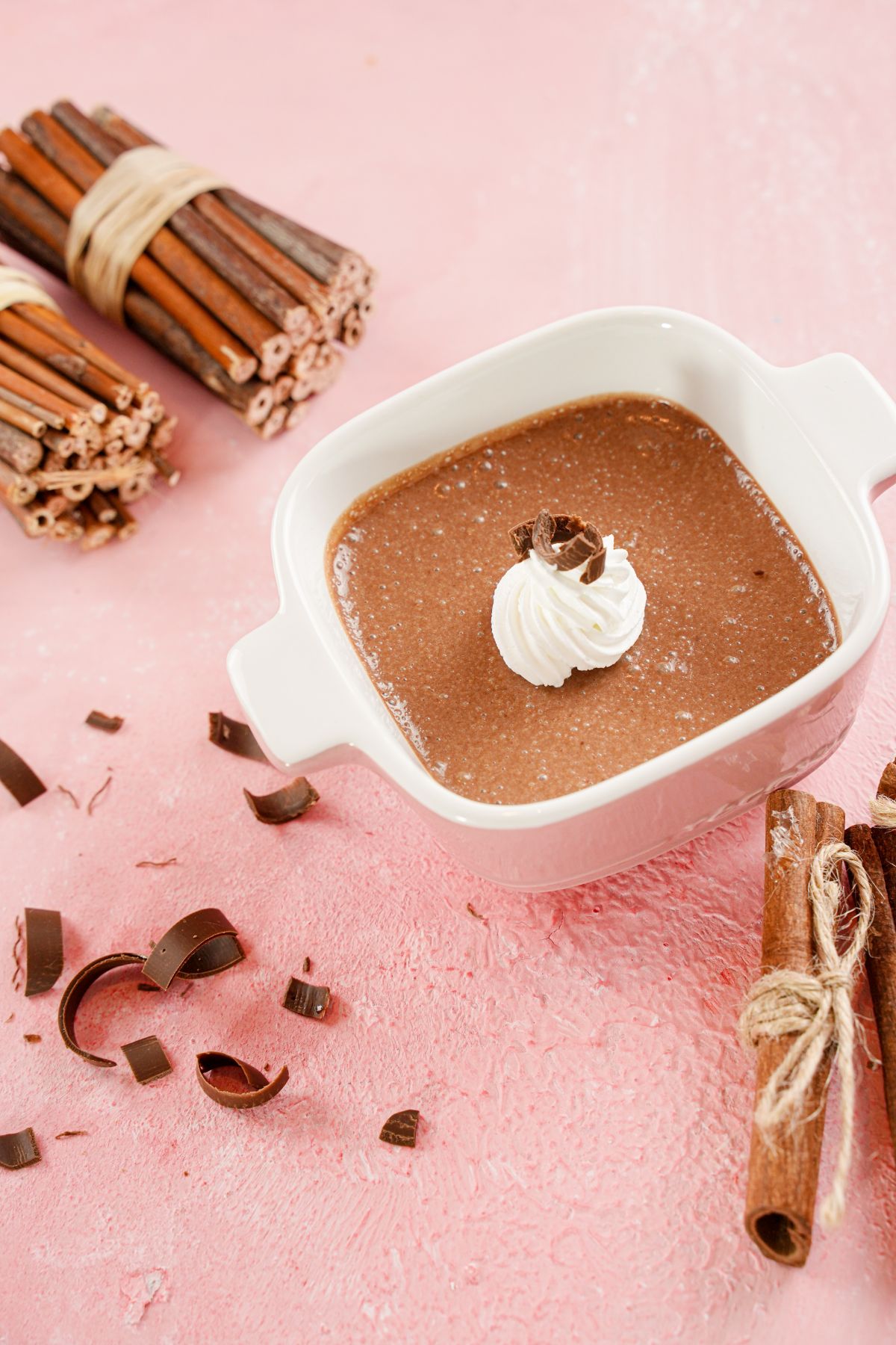 Chocolate Pots de Creme in a bowl on a wooden table