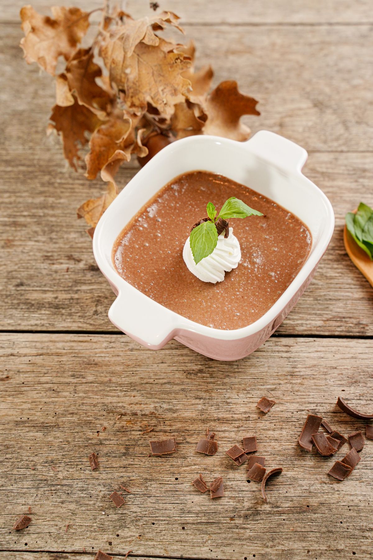 zoom pic of Chocolate Pots de Creme in a bowl on a wooden table