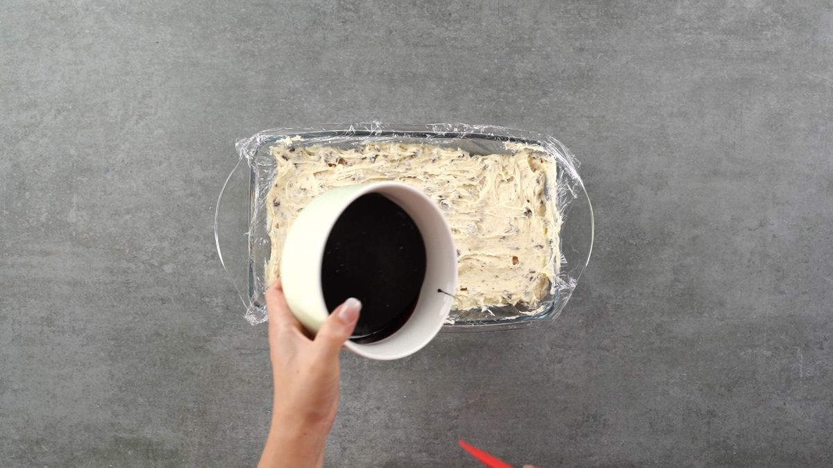 add graham crackers as base layer then add ⅓ of cookie dough and pour chocolate Sauce to the baking bowl