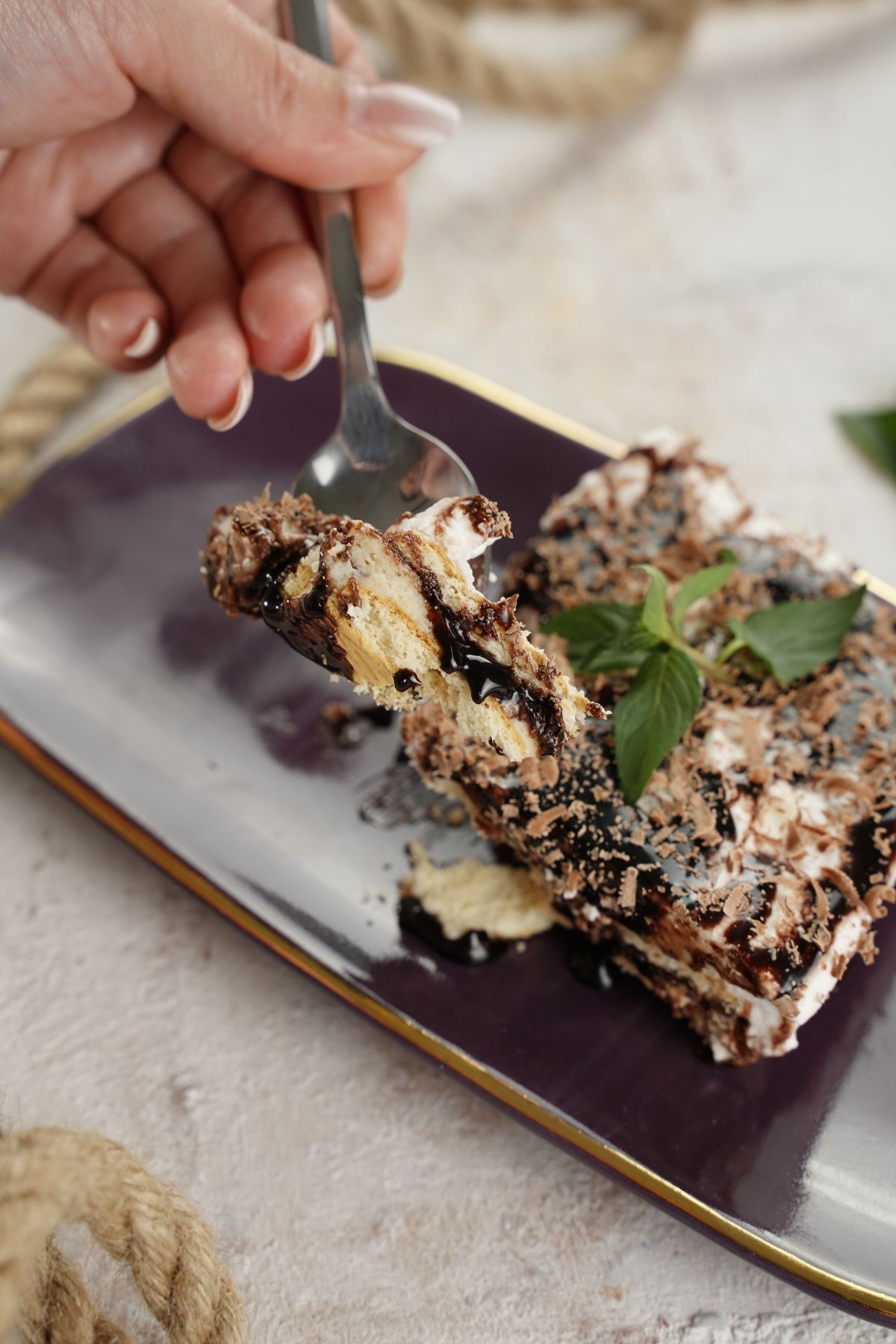 easy cookie dough lasagna being served on a spoon