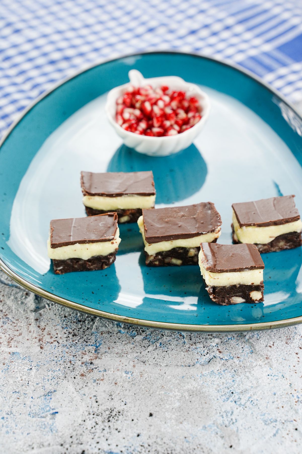 Copycat Nanaimo Bars served on a blue plate