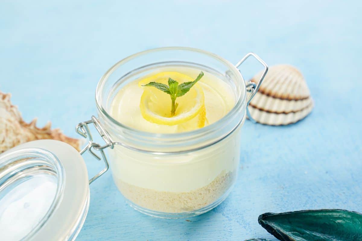Creamy Lemon Mousse decorated with mint leaf in jar