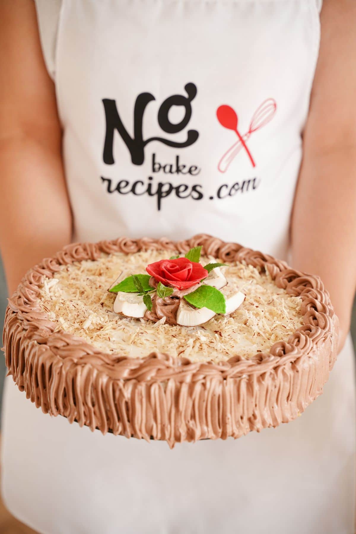 No Bake Banana Coconut Cream Pie served with rose and coconut pieces