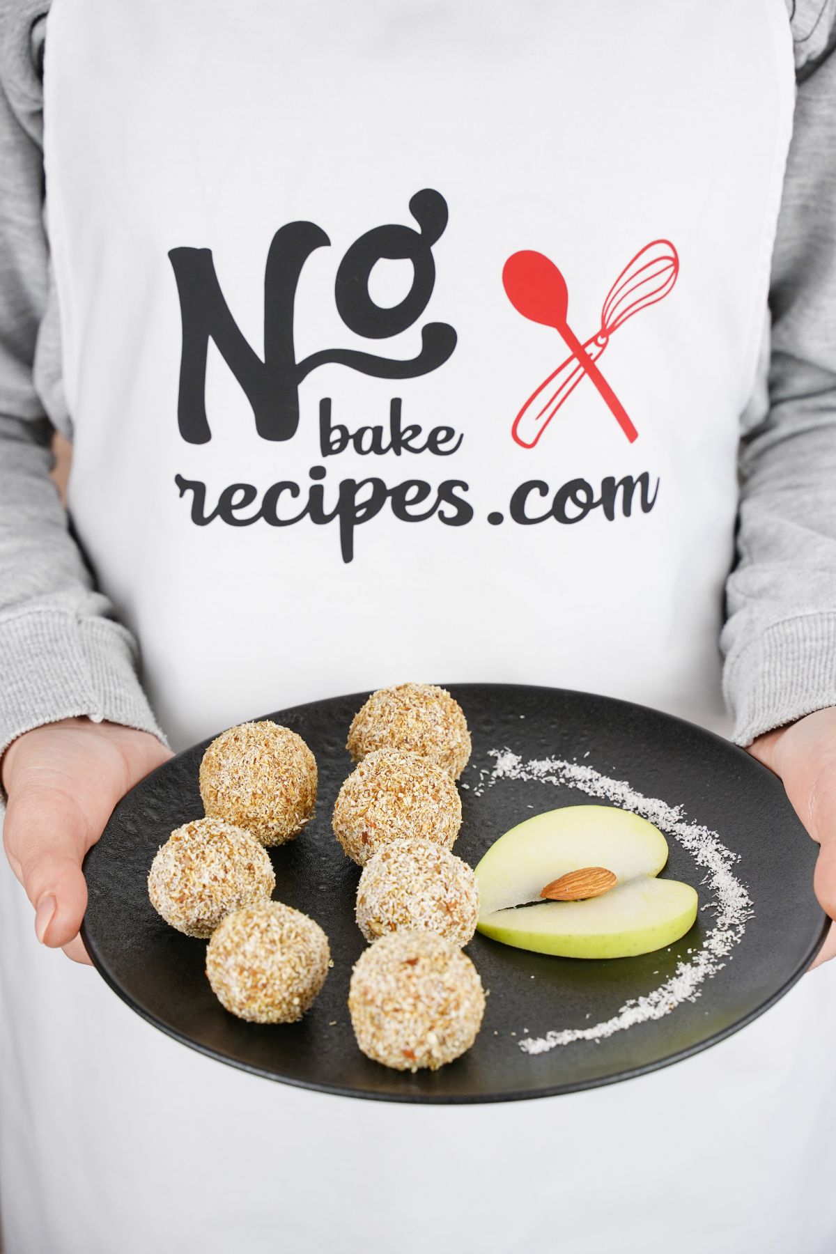 No-Bake Carrot Balls on a plate with slices of avocado