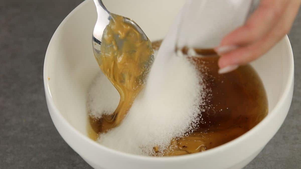 add sugar, honey and peanut butter in a  bowl and mix thoroughly