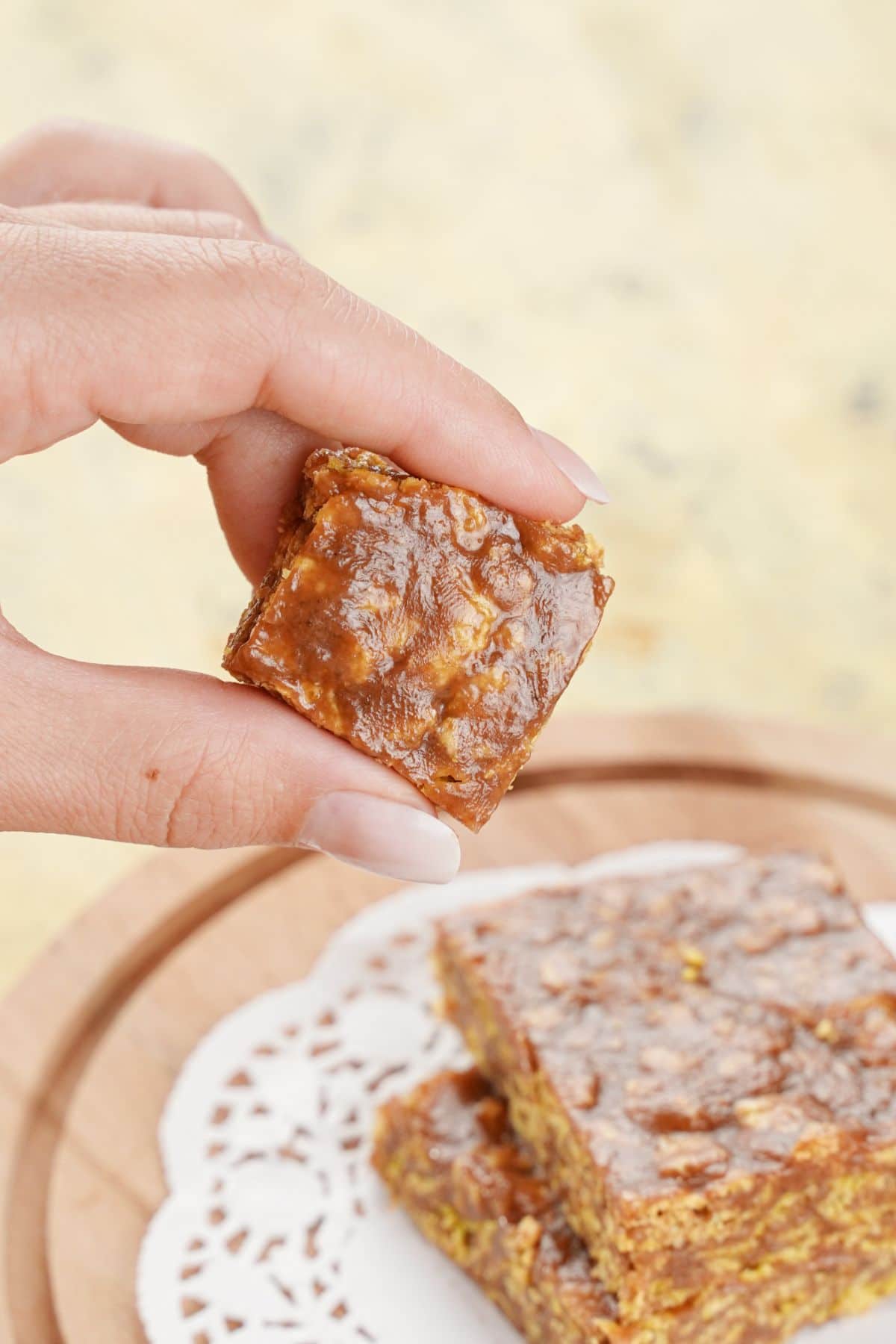 hand holding a square of chocolate cereal bars