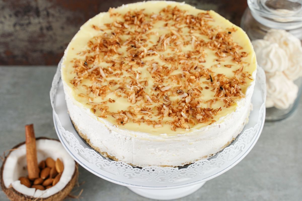 No-Bake Coconut Layered Dessert ready to enjoy with some almonds in half coconut
