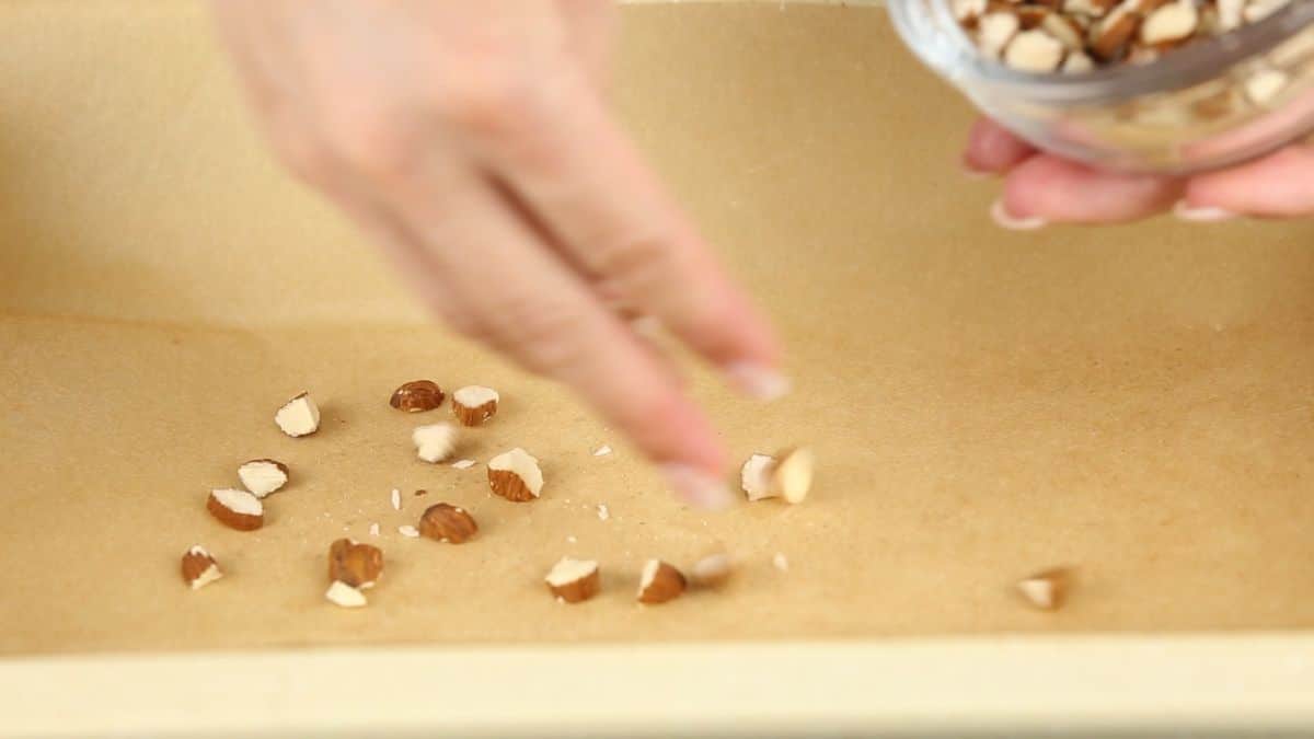 add chopped almonds as the base layer in the mould