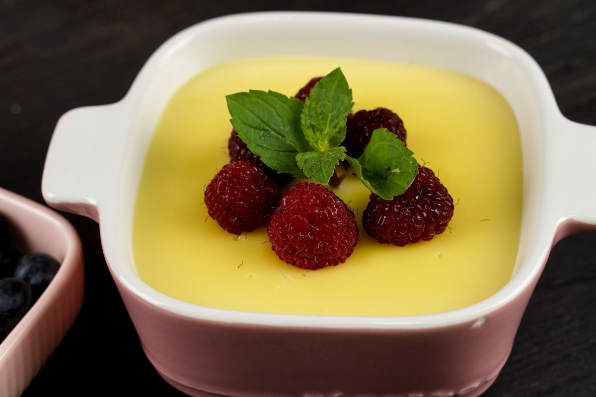 No-Bake Homemade Vanilla Pudding in a square bowl and decorated with some berries