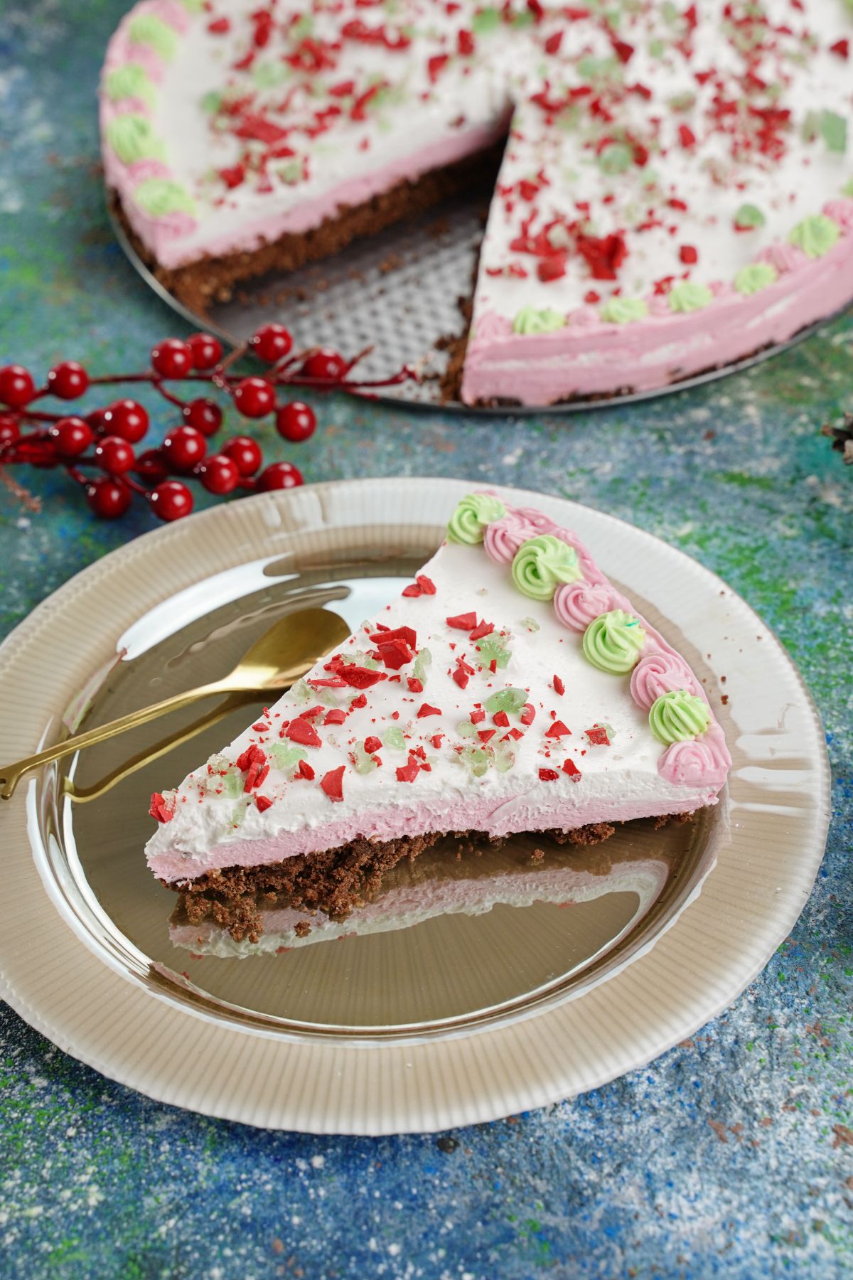 A piece of No-Bake Peppermint Pie with fresh berries