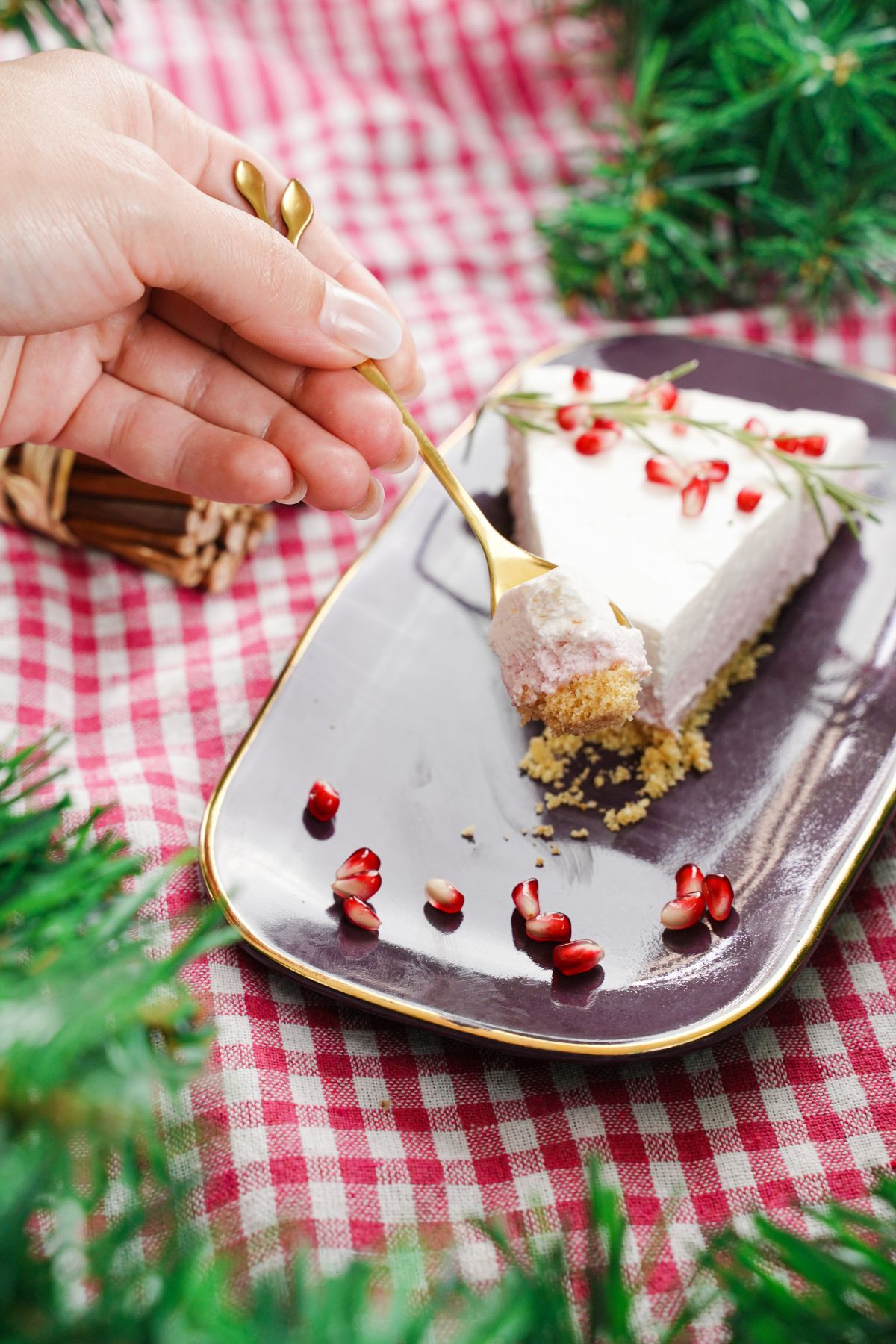 no bake pomegranate cheesecake being served with a spoon