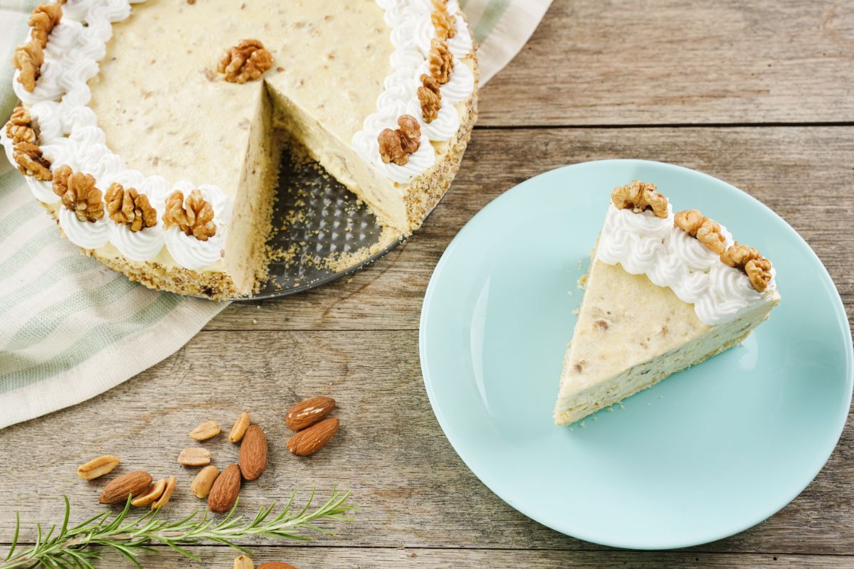 A piece of No-Bake Walnut Cream Pie with some almonds in the background