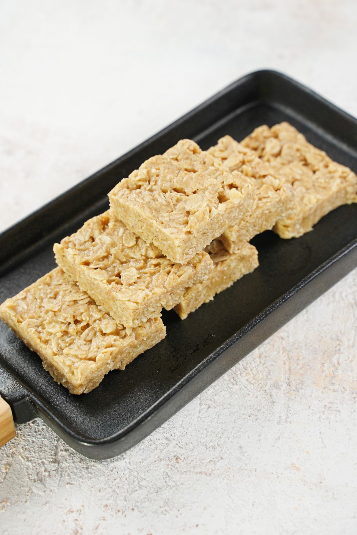 Peanut Butter Oat Bars served in a black tray
