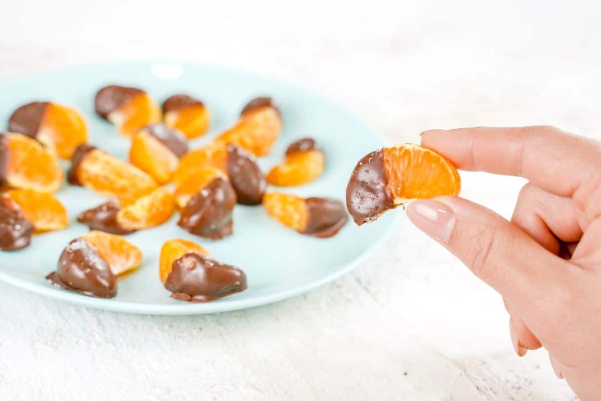 Side view image of Chocolate Covered Oranges in right hand