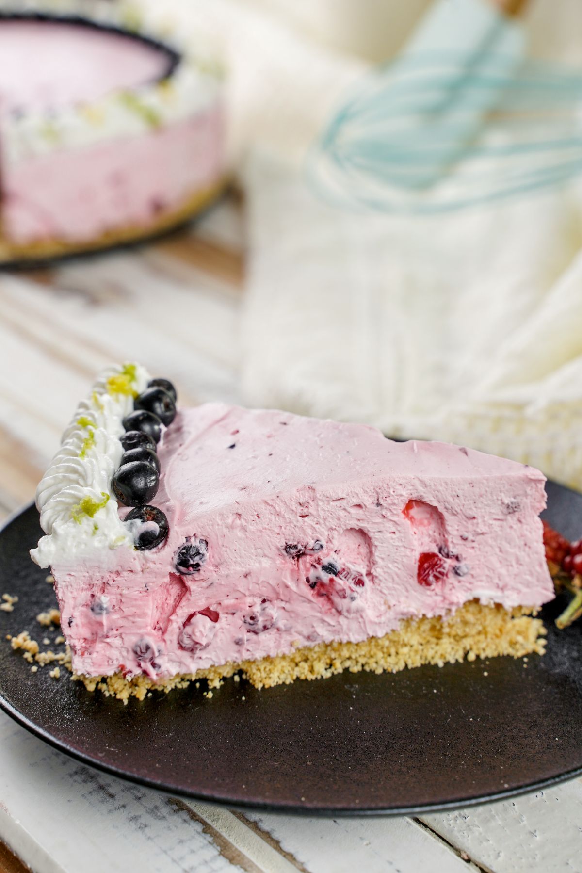 Side view image of piece of No-Bake Fruit Smoothie Cheesecake