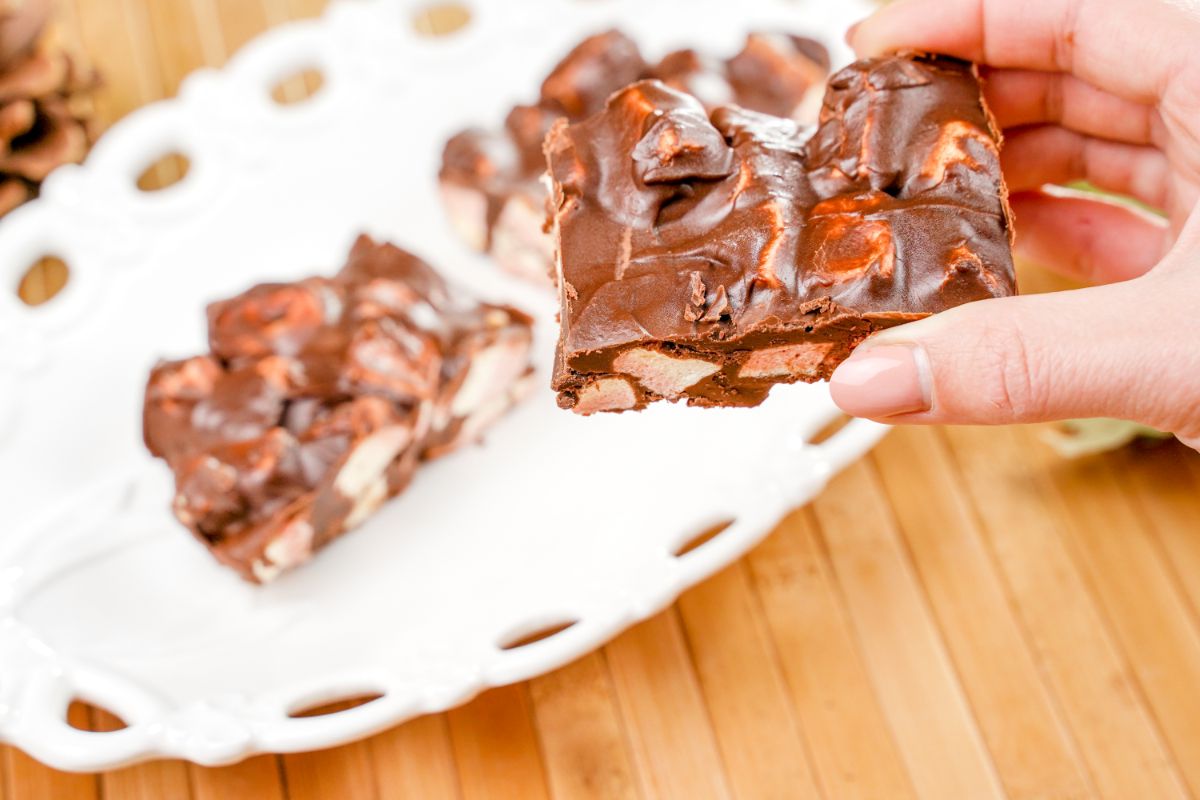 A piece of No-Bake Confetti Squares in fingers