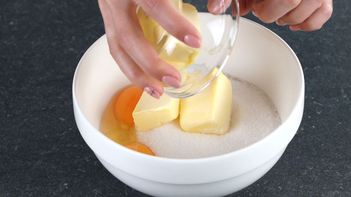 add eggs, butter and sugar in a bowl and mix well