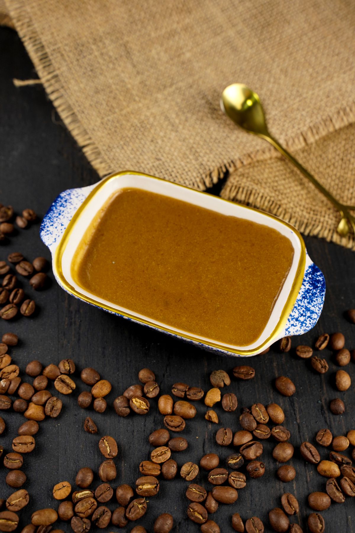 No Bake Espresso Creme Brulee served with a golden spoon