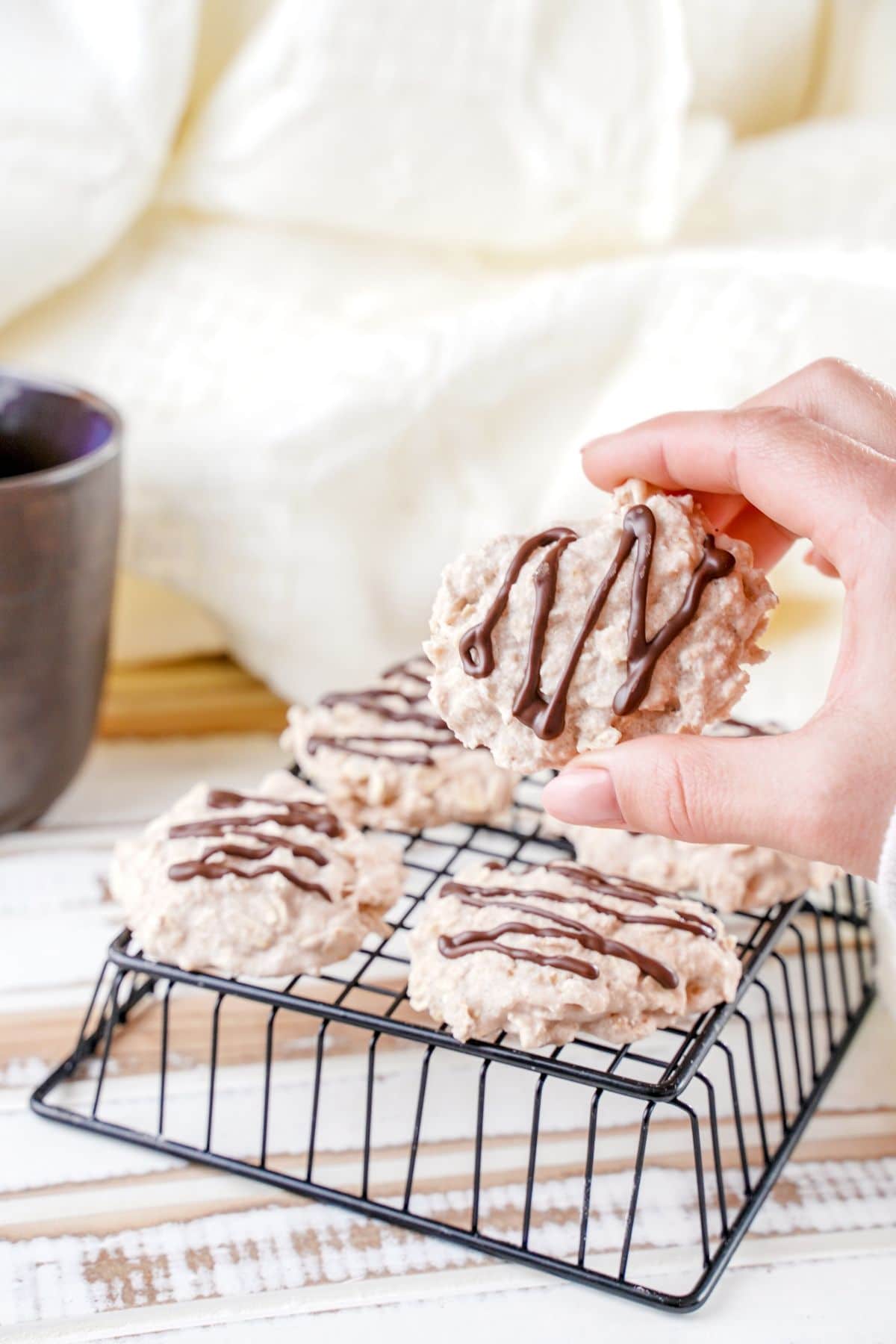 No-Bake White Chocolate Cookies in fingers