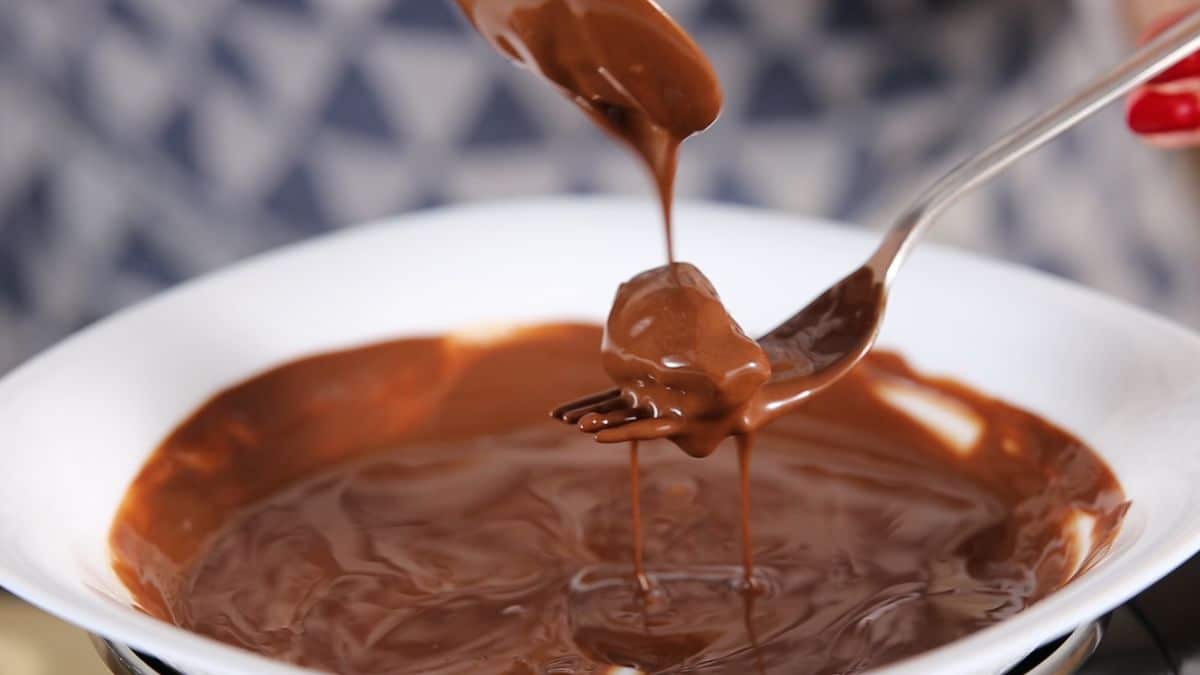 Cover the dates with melted chocolate