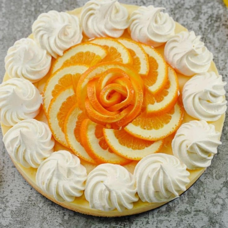 Orange cream pie on a countertop.