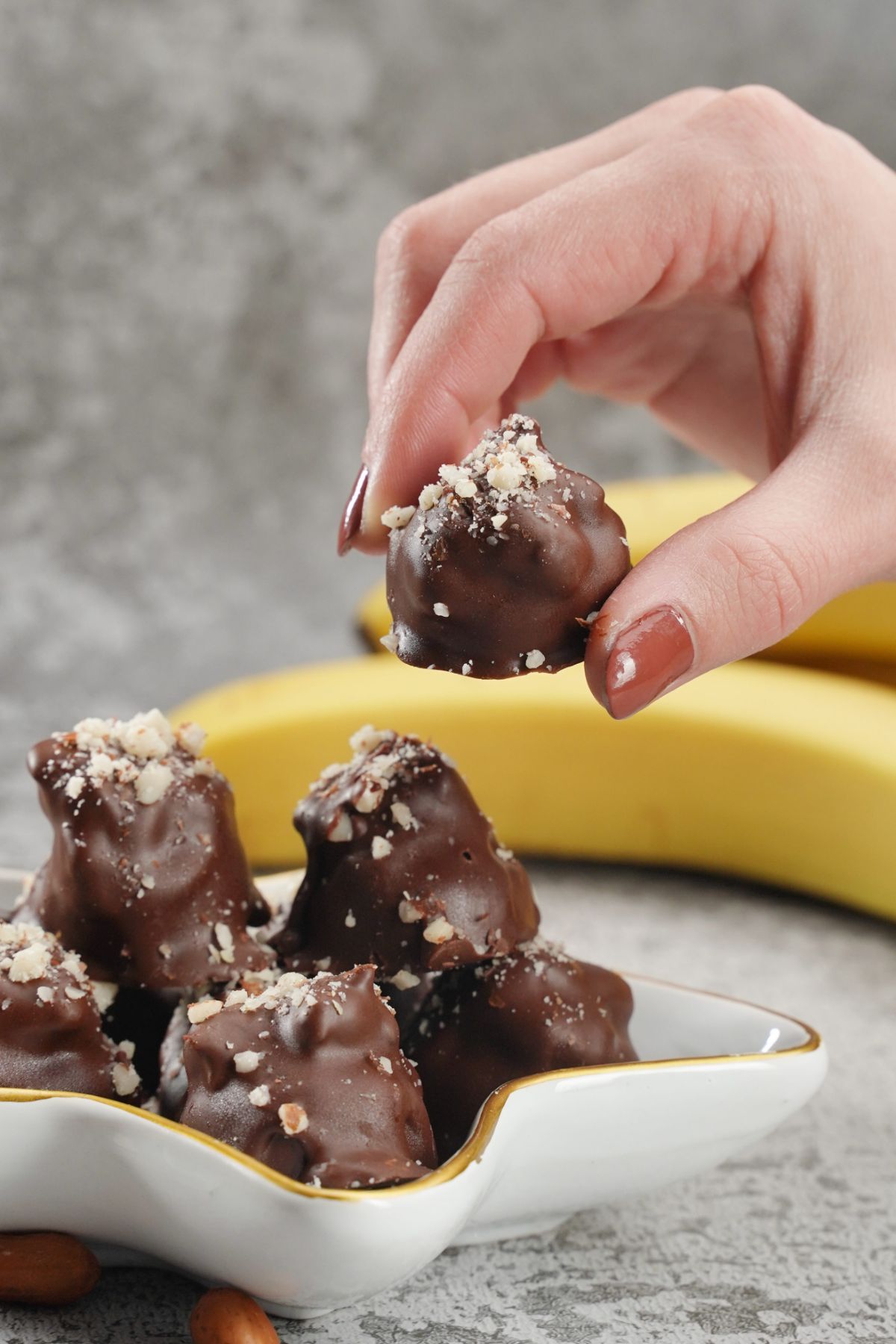 No-Bake Snickers Bites in fingers