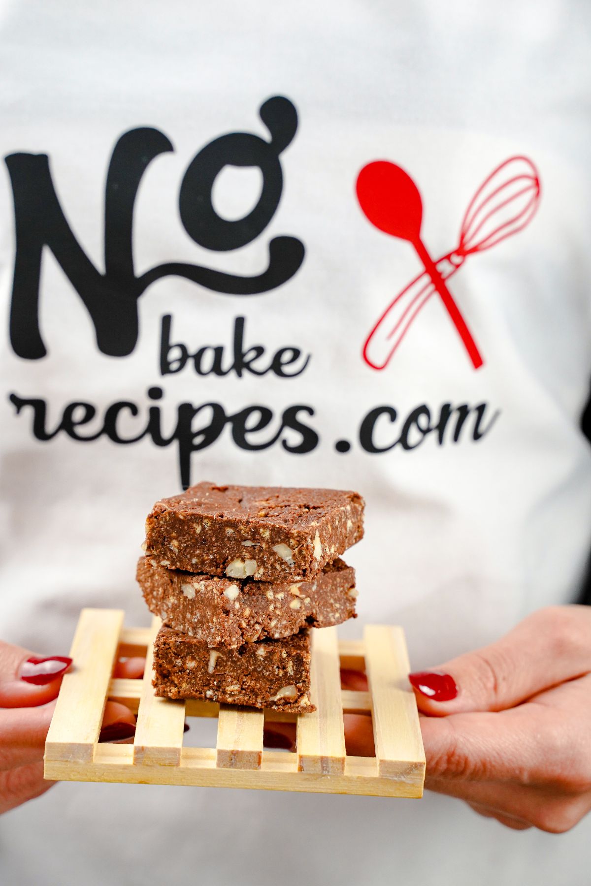 No-Bake Triple Chocolate Brownies placed one over the above on a wooden rack
