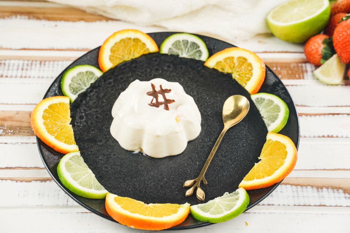Orange Panna Cotta served on a plate decorated with chocolate 