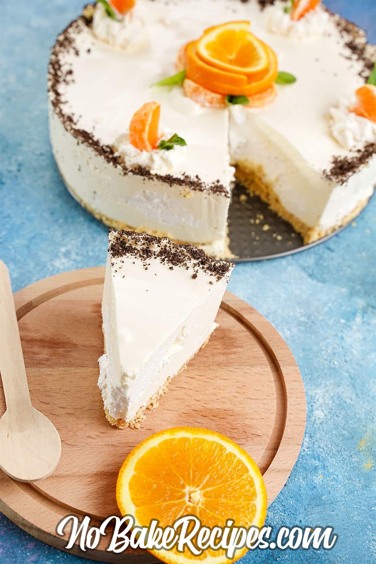 slice of orange cheesecake on a plate with the whole cheesecake behind it
